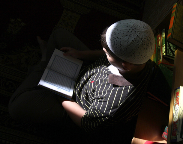 A man reads the Koran at a mosque in the West Bank city of Ramallah during the Muslim holy fasting month of Ramadan where Muslims around the world fast from dawn until dusk. (AFP)