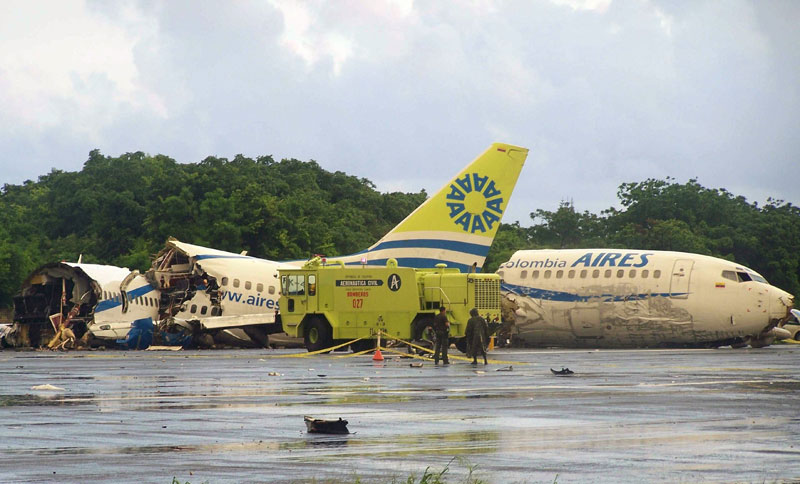 A plane that crashed lays in pieces along the runaway at the airport on San Andres island in Colombia. (AP)