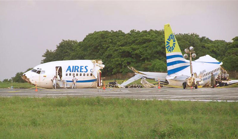 The wreckage of the Aires airlines aircraft that crashed upon landing on the airport of the Colombian island of San Andres. A Colombian passenger jet operated by local airline Aires crashed with 131 people on board while landing on the island on Monday during a storm, injuring 114 passengers while one died of heart attack, local authorities said. (AFP)
