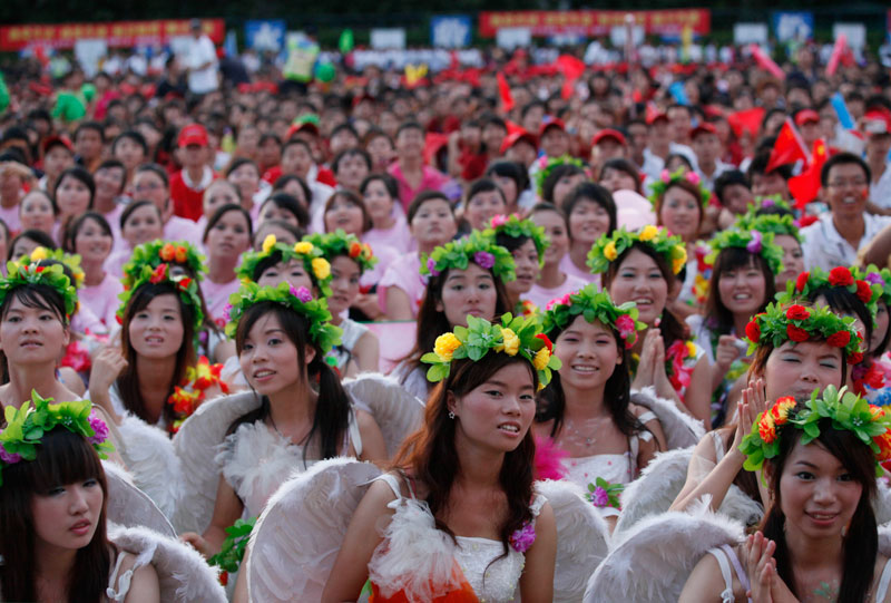 Foxconn workers attend a rally to raise morale at the heavily regimented factories inside the Foxconn plant in Shenzhen, south China, Guangdong province. (AP)