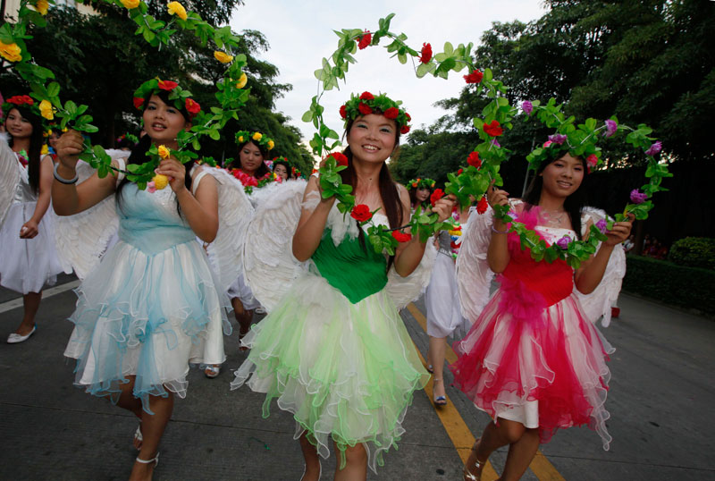 Foxconn workers dress as angels during a rally as to raise morale at the heavily regimented factories inside the Foxconn plant in Shenzhen, south China, Guangdong province. (AP)