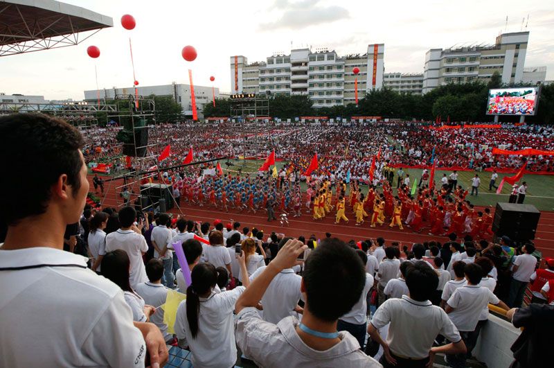 Thousands of Foxconn workers attend a rally as to raise morale at the heavily regimented factories inside the Foxconn plant in Shenzhen, south China, Guangdong province. (AP)