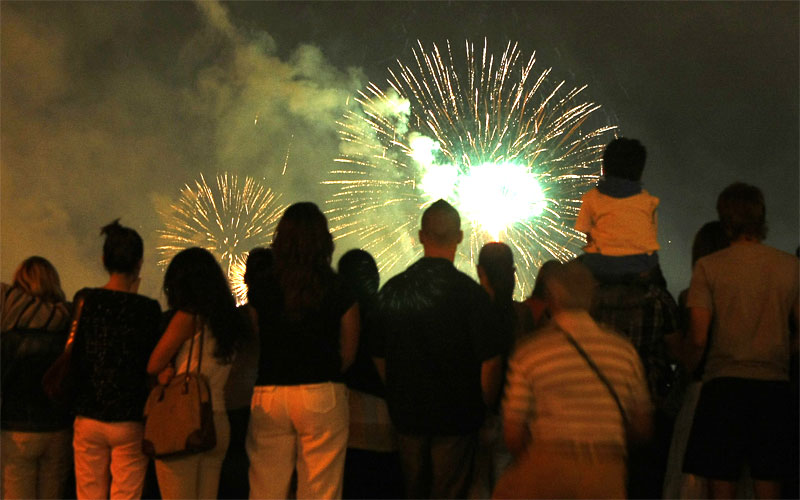 People gather on Gellert Hill in Budapest watch a fireworks display as part of the national day's celebration. (AFP)