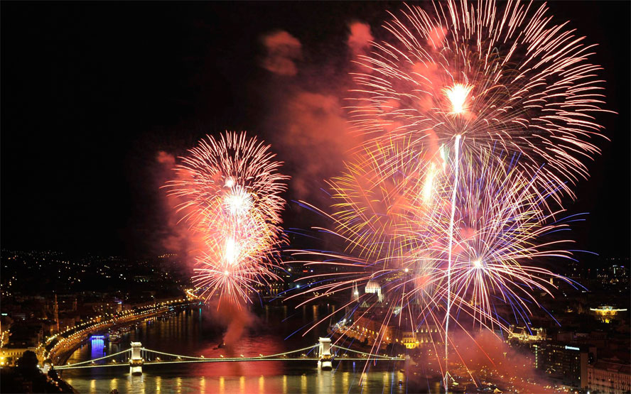 Fireworks fired from barges on the river Danube explode over the river in Budapest, Hungary. (EPA)