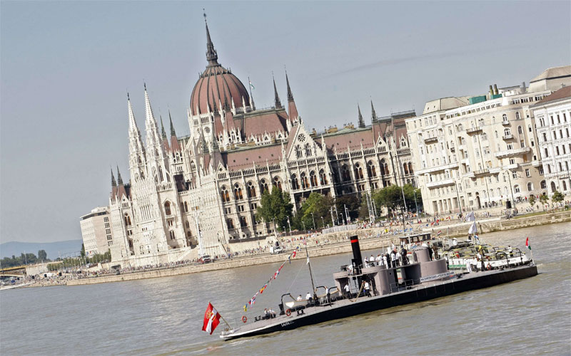 A renovated warship cruises along the Danube River in front of the Parliament building in Budapest on August 20, 2010. The voyage marks the anniversary of the founding of the nation by the first Hungarian king, Stephen I. The ship, which resemebles the American warship, the USS Monitor, was built in Hungary in 1871 and reconstructred by the Hungarian Army Museum. (AFP)