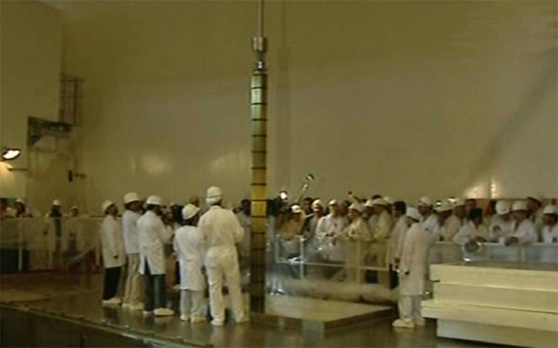 An image grab taken from footage broadcast by Iran's state-run Arabic-language Al-Alam TV, shows officials and engineers during the launching of the Russian-built first nuclear power plant in the Iranian southern port of Bushehr after more than three decades of delay. (AFP)