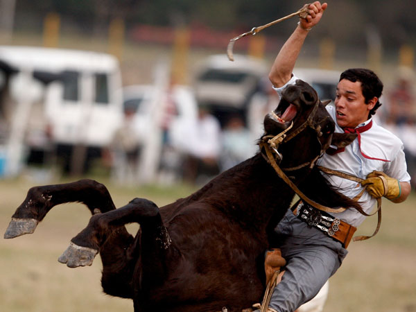 An Argentine gaucho, or cowboy, competes during a rodeo in Jauregui, Argentina. (AP)