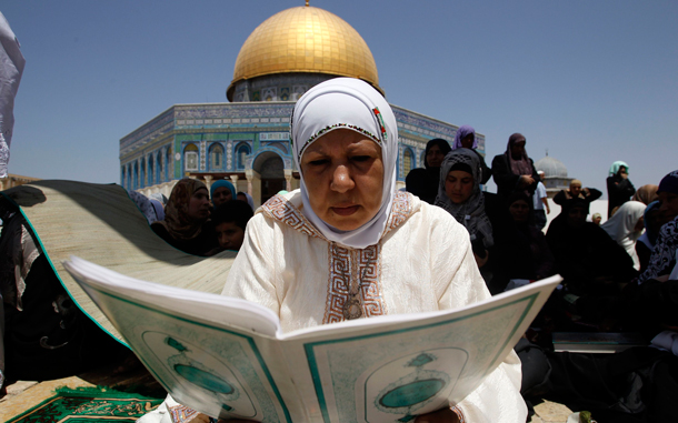 A Muslim woman prays in front of the Dome of the Rock on the compound known to Muslims as al-Haram al-Sharif and to Jews as Temple Mount. (REUTERS)