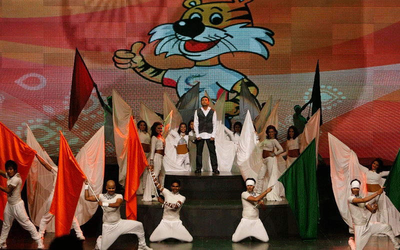 Indian music composer A.R. Rahman, center, presents the theme song for the upcoming Commonwealth Games in Gurgaon, India. (AP)