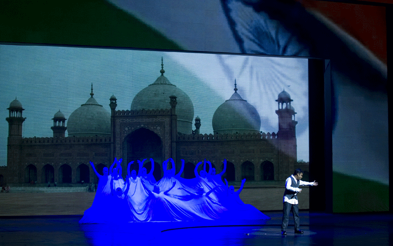 Oscar-winning Indian composer, A R Rahman (C) performs the theme song of the Commonwealth Games 2010 in Gurgaon on the outskirts of New Delhi. (AFP)