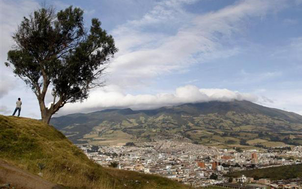 A man looks at the Galeras volcano in Pasto, southern Colombia. Colombia's Galeras volcano erupted on Wednesday, forcing authorities to order the evacuation of thousands of residents from nearby villages and towns, officials said. Around 8,000 people live in risky areas nearby, but many often refuse to leave their homes after frequent eruptions. (REUTERS)