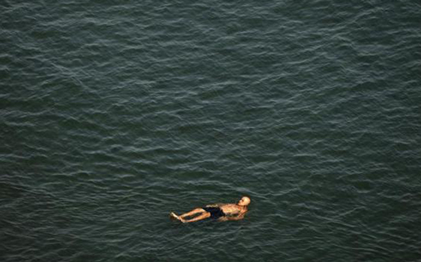 A man floats in the sea on a hot summer day in El Rincon de la Victoria, near Malaga, southern Spain. Temperatures were forecast to exceed 44 degrees Celsius (111.2 degrees Fahrenheit) in many parts of Spain, with peaks of 42 to 44 degrees Celsius (107-111 degrees Fahrenheit) in the south. (REUTERS)