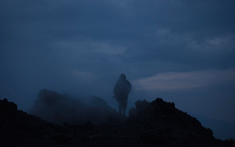 A Congolese soldier and guard for Virunga National Park carries his weapon along the rim of the smouldering crater of Nyiragongo volcano near Goma in eastern Congo. (REUTERS)