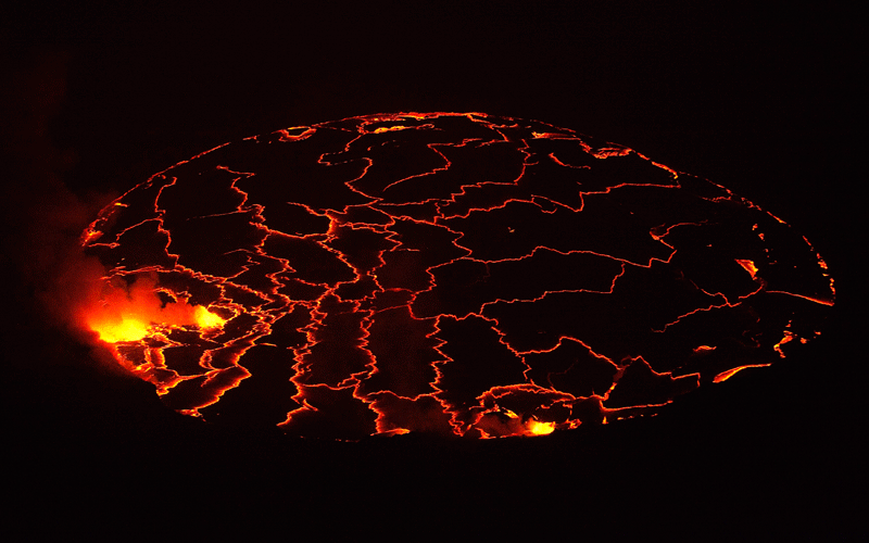 A lava lake with a diameter of 300 meters (500 feet) glows at night in the crater of Nyiragongo volcano near Goma in eastern Congo. (REUTERS)