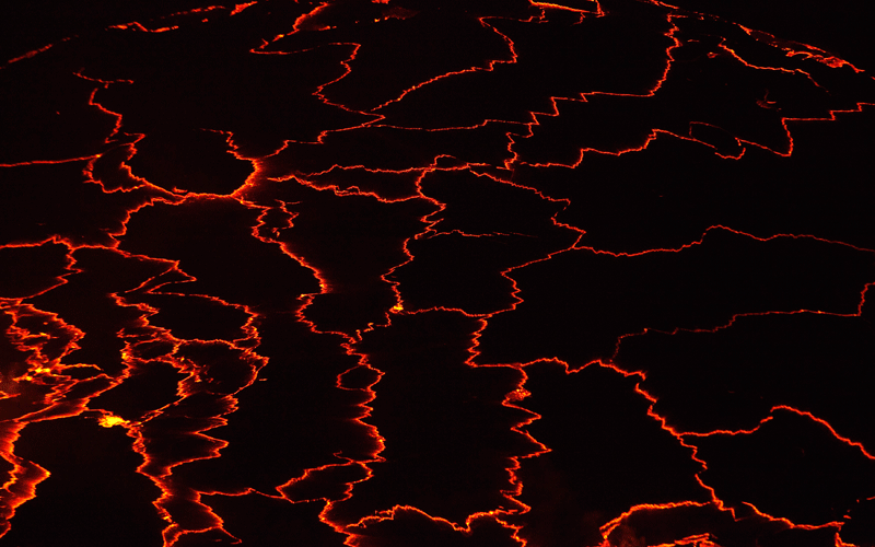 A lava lake with a diameter of 300 meters (500 feet) glows at night in the crater of Nyiragongo volcano near Goma in eastern Congo. (REUTERS)