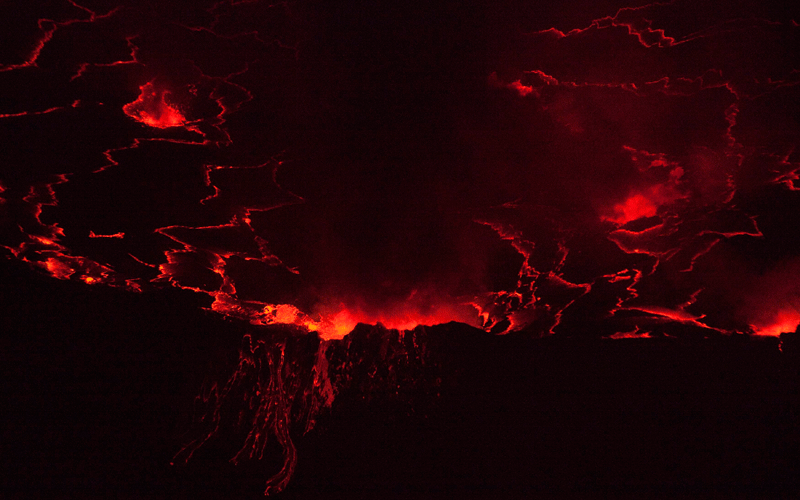 A lava lake with a diameter of 300 meters (500 feet) glows at night in the crater of Nyiragongo volcano near Goma in eastern Congo. (REUTERS)