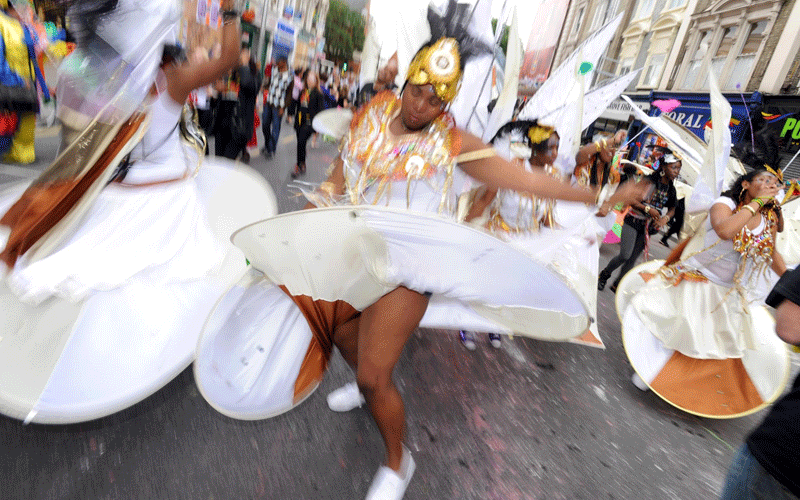 Dancers and bands march along the carnival route during the Notting Hill Carnival held in West London, Britain. (EPA)