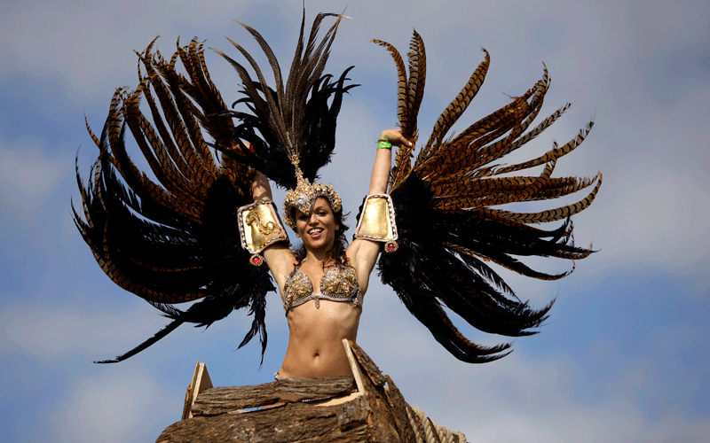 A costumed reveller performs in the Notting Hill Carnival in London. (AP)