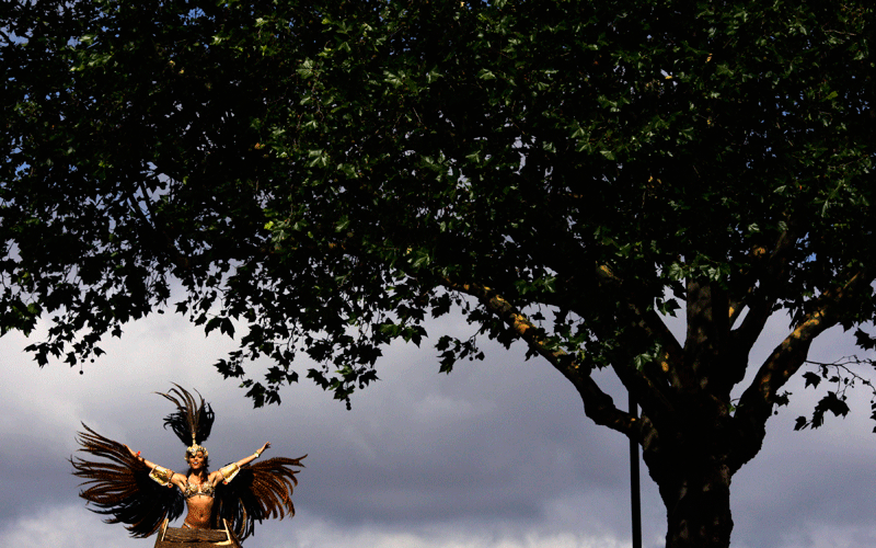 A costumed reveller performs in the Notting Hill Carnival in London. (AP)