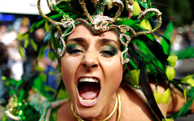 A costumed reveller performs in the Notting Hill Carnival in London. (AP)