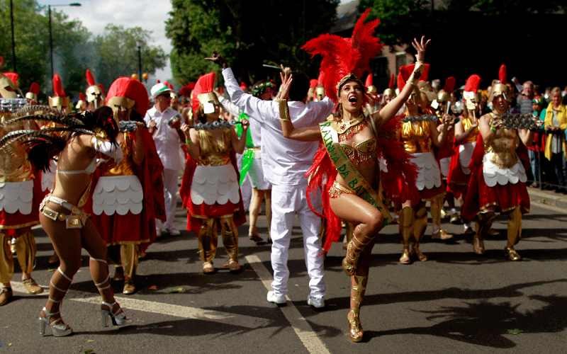 Costumed revellers perform in the Notting Hill Carnival in London. (AP)