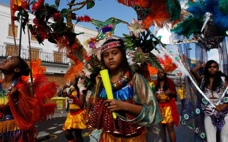 Revellers wearing costumes  during the Notting Hill Carnival in London. (AP)