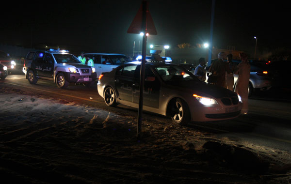 Police vehicles are seen as police secure the scene of a plane crash in Dubai. (REUTERS)