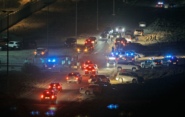 Police and security forces block the gate of a military base which was  the site of a cargo plane crash in Dubai, United Arab Emirates. (AP)