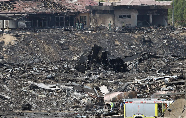 United Arab Emirates (UAE) emergency workers inspect the site where a cargo airplane crashed while taking off from Dubai airport, United Arab Emirates. (EPA)