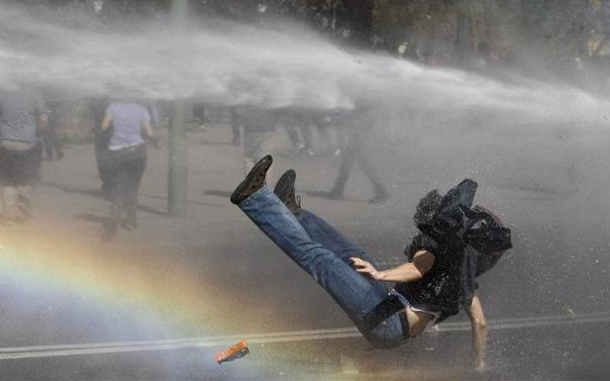 Riot police spray water on a high school student during a protest in Valparaiso city, about 121 km (75 miles) northwest of Santiago. Students protested against changes to the public state education and are demanding that government increase their budget to fund universities, according to local media. (REUTERS)