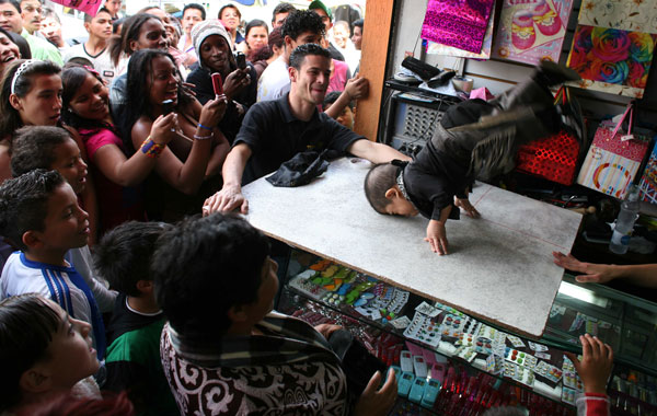 Edward Nino Hernandez, 24, performs at a retail shop in Bogota, Colombia. (AP)