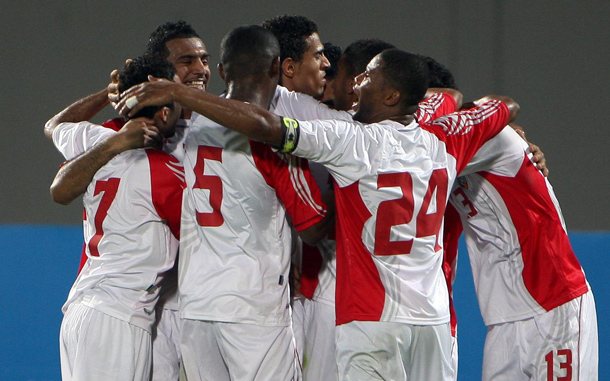 UAE players celbrate after scoring the third goal and winning the match against Kuwait during their friendly soccer match at Al-Nahyan stadium in Abu Dhabi, United Arab Emirates. (EPA)