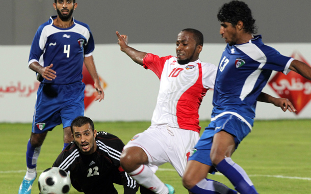 Emirati player Ismail Matar (2nd R) shoots to score past Mussaid Nada (R) and goalkeeper goalkeeper Nawaf al-Khalidi (2nd L) of Kuwait during their friendly football match at Al-Nahayan stadium in Abu Dhabi. (AFP)