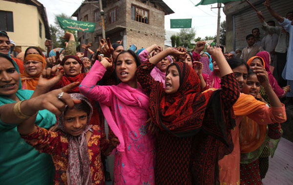 Kashmiri Muslim women shouts slogans during a protest on the outskirts of Srinagar, the summer capital of Indian Kashmi. (EPA)