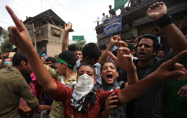 Kashmiris shouts slogans during a protest on the outskirts of Srinagar, the summer capital of Indian Kashmir. (EPA)