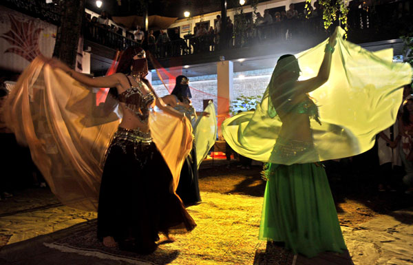 Belly dancers with face veils perform during the Sounds of the Old Bazaar cultural event that takes place in the Old Bazaar in Skopje, Macedonia. (AP)