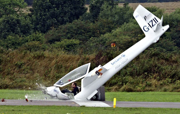 Destruction: The entire front section of the aircraft is smashed to smithereens - leaving pilot Mike Newman dangerously exposed. (FILE)