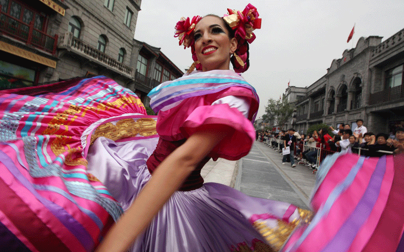 A performer from Mexico dances during the opening ceremony of the Beijing International Tourism Festival in Beijing, China. (EPA)