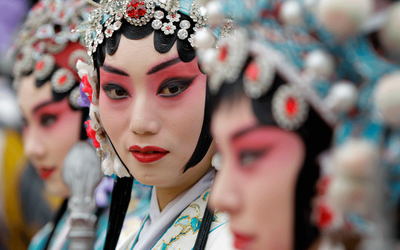 Chinese Peking Opera performers wait for the opening ceremony of 12th Beijing International Tourism Festival at Qianmen Commercial Street, in Beijing. (REUTERS)