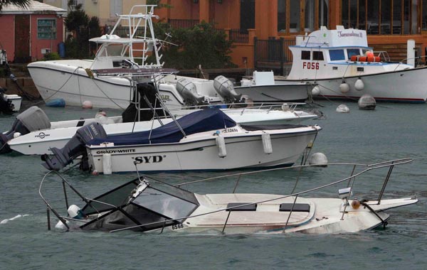 A boat is swamped with water at Flatts Inlet in Smith's parish while Hurricane Igor comes ashore in Bermuda. (AP)