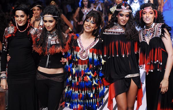 Fashion designer Malini Ramani (C) acknowledges the audience's applause after the launch of her new collection during the Lakme Fashion Week. (EPA)