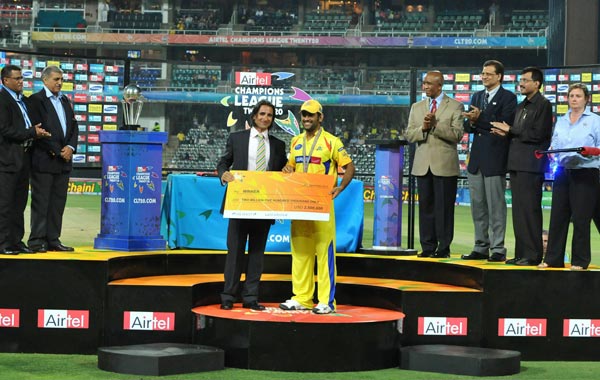 Mahendra Singh Dhoni of the Kings receives his winnings during the 2010 Airtel Champions League Twenty20 final match between Chennai Super Kings and Chevrolet Warriors from Bidvest Wanderers Stadium. (GETTY IMAGES)