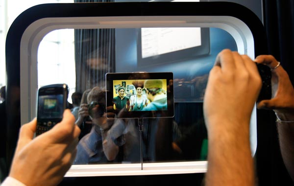 Conference attendees takes photos of the new Blackberry PlayBook at the Research in Motion Blackberry developer's conference in San Francisco, California. (Reuters)