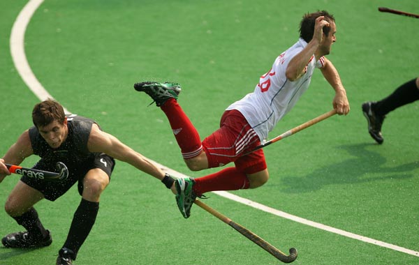 Nick Catlin of England dives in the Men's Pool B match between New Zealand and England at Major Dhyan Chand National Stadium during day six of the Delhi 2010 Commonwealth Games. (GETTY)