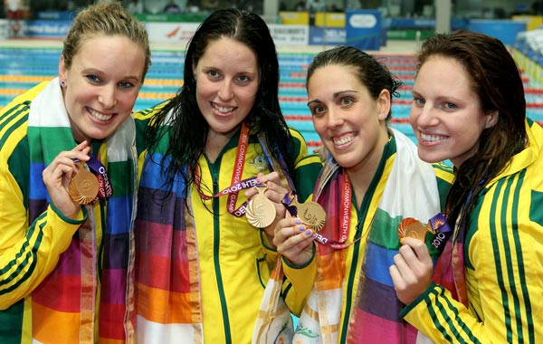 Gold placed medalists Australia pose during the medal ceremony for the Women's 4x100m Freestyle Final at Dr. S.P. Mukherjee Aquatics Complex during day five of the Delhi 2010 Commonwealth Games. (GETTY)