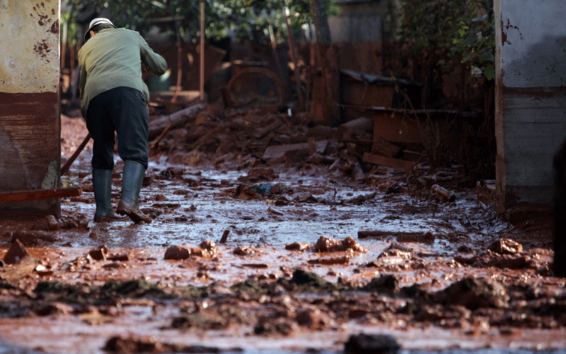 A local man cleans yard in the flooded town of Devecser, 150 km (93 miles) west of Hungarian capital Budapest. (AFP)