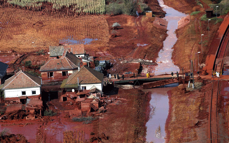 An aerial view of rescue team members crossing a pontoon-bridge replacing the original bridge washed away by a sludge flood in Kolontar, 167 kms southwest of Budapest, Hungary. (AP)