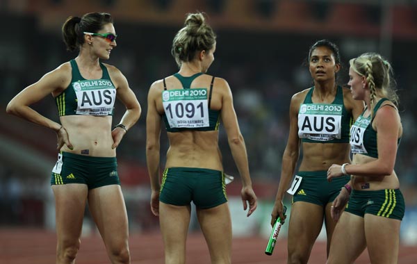 (L-R) Lauren Boden, Pirrenee Steinert, Jody Henry and Olivia Tauro of Australia chat after competing in the women's 4 x 400 metres relay first round at Jawaharlal Nehru Stadium during day eight of the Delhi 2010 Commonwealth Games. (GETTY)