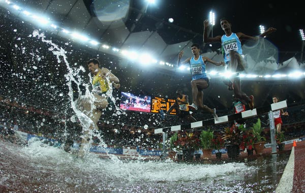 Elam Singh (1480) of India and Ramachandran Ramadas of India compete in the men's 3000 metres steeplechase at Jawaharlal Nehru Stadium during day eight of the Delhi 2010 Commonwealth Games. (GETTY)