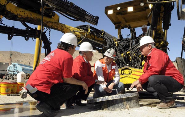 A handout photograph provided by the Chilean Presidency shows Chilean President, Sebastian Pinera (2L), along his Minery Minister, Laurence Golborne (L), and his Health Minister, Jaime Manalich (R), cheking the zone on the camp next to San Jose mine, near Copiapo, Chile. (EPA)